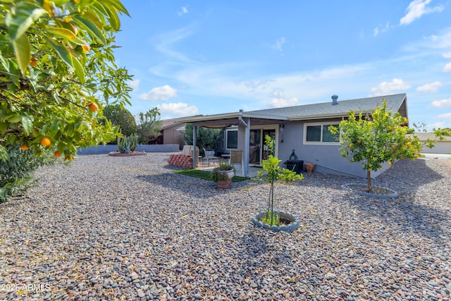 single story home featuring stucco siding and a patio