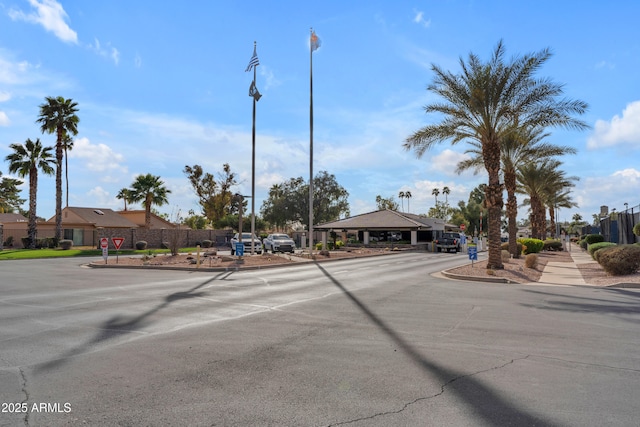 view of street with traffic signs, street lighting, and curbs