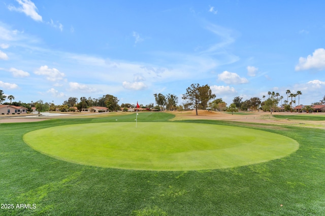 surrounding community featuring view of golf course