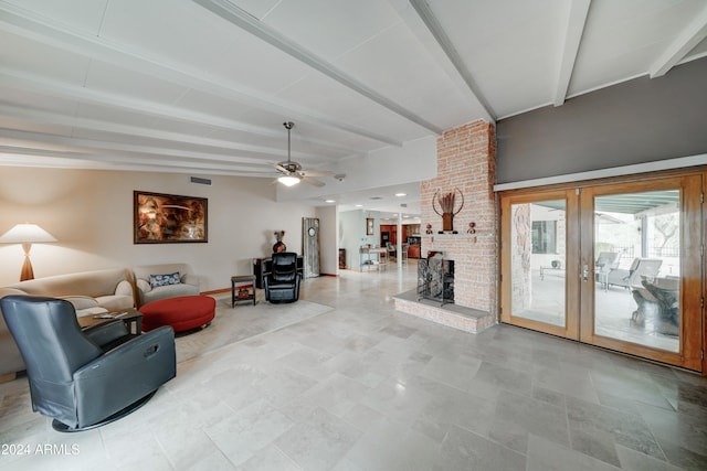 living room with ceiling fan, lofted ceiling with beams, a fireplace, and french doors