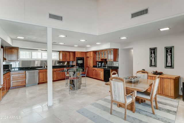 dining area with light tile patterned floors and sink