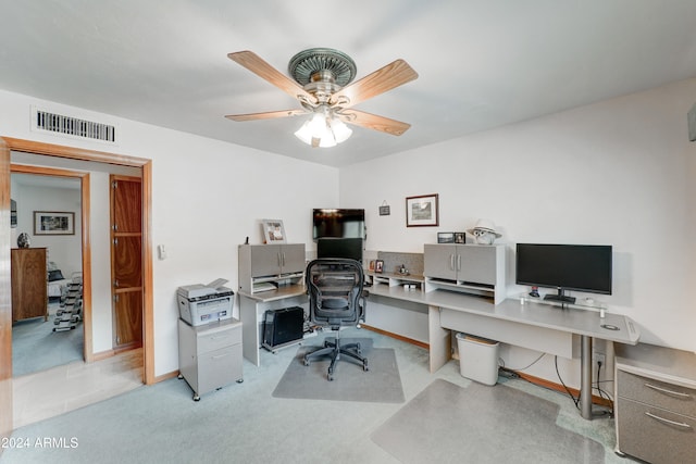 office space with light carpet and ceiling fan