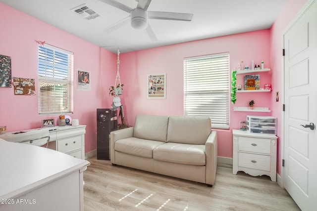 bedroom with light wood-type flooring, baseboards, visible vents, and ceiling fan