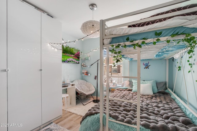 bedroom featuring wood finished floors