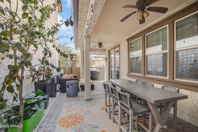 view of patio / terrace with ceiling fan, a grill, fence, outdoor dining area, and outdoor lounge area