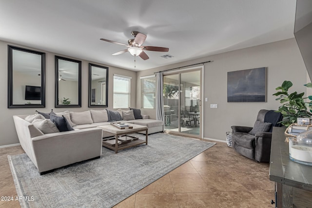 living room with light tile patterned flooring and ceiling fan