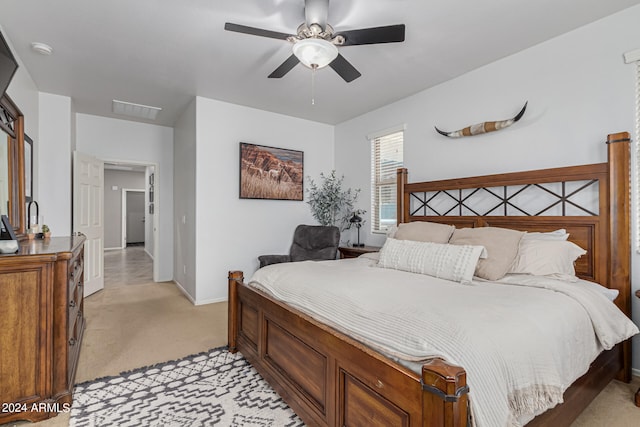 carpeted bedroom with ceiling fan