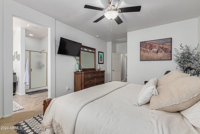 bedroom with connected bathroom, ceiling fan, and carpet floors