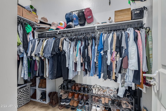 spacious closet featuring carpet floors