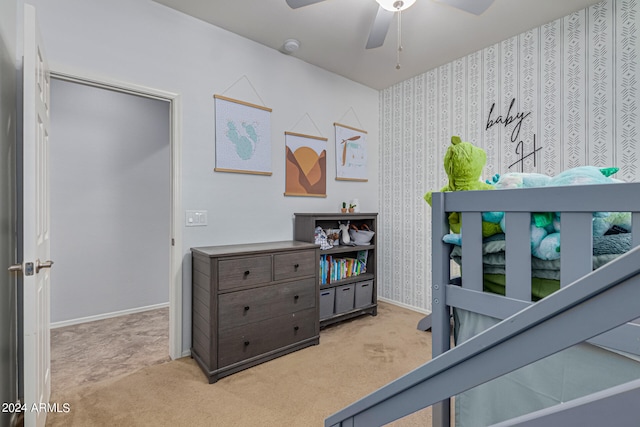 bedroom with light colored carpet and ceiling fan