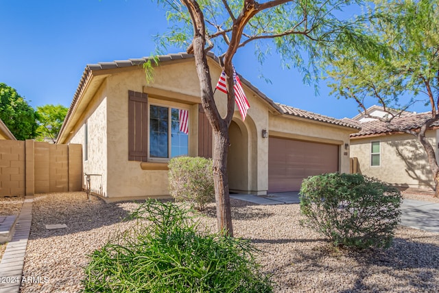 view of front of property with a garage