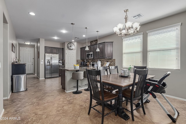 dining room featuring a chandelier