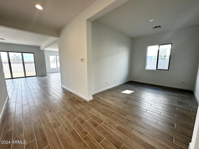 empty room with dark wood-type flooring