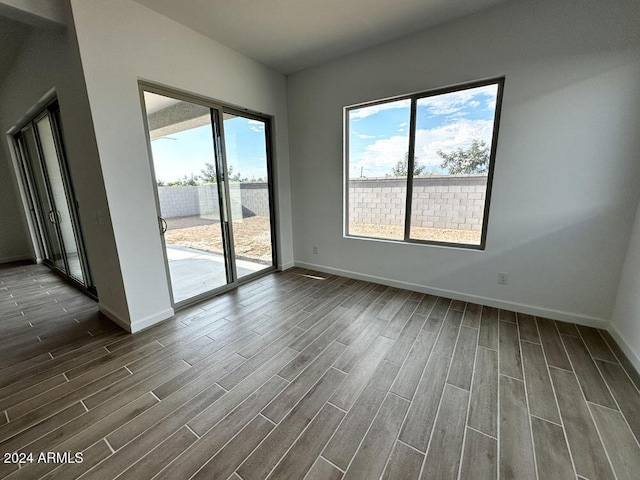 unfurnished room featuring a healthy amount of sunlight