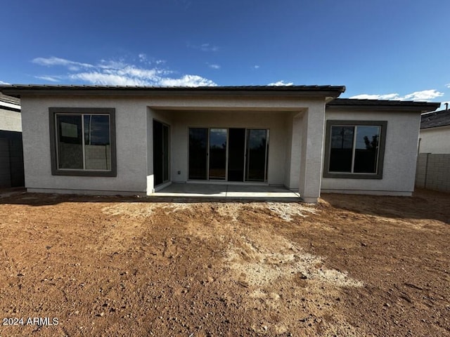 rear view of house featuring a patio