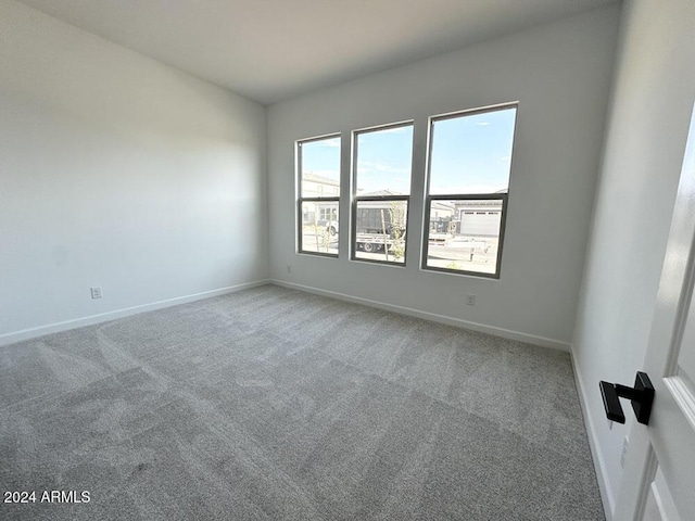 unfurnished room featuring carpet floors