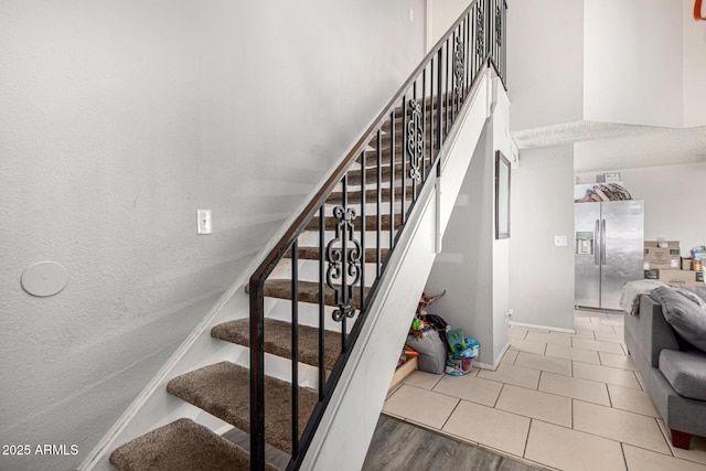 3646 N 67th Ave Unit 29, Phoenix, AZ 85033 - staircase featuring baseboards and tile patterned flooring