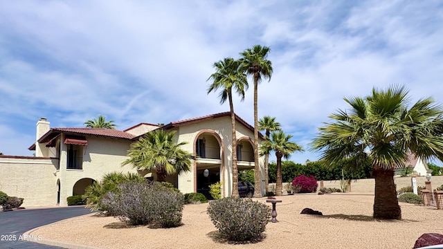 8426 N 15th Dr, Phoenix, AZ 85021 - mediterranean / spanish house with a tile roof, a chimney, and stucco siding