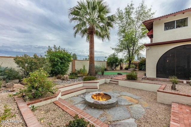 8426 N 15th Dr, Phoenix, AZ 85021 - view of yard featuring a fenced backyard, an outdoor fire pit, and a patio