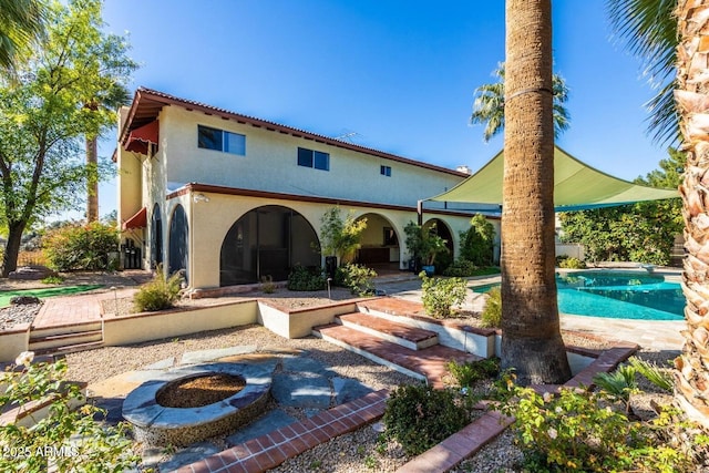 8426 N 15th Dr, Phoenix, AZ 85021 - rear view of house with a patio area, an outdoor pool, and stucco siding
