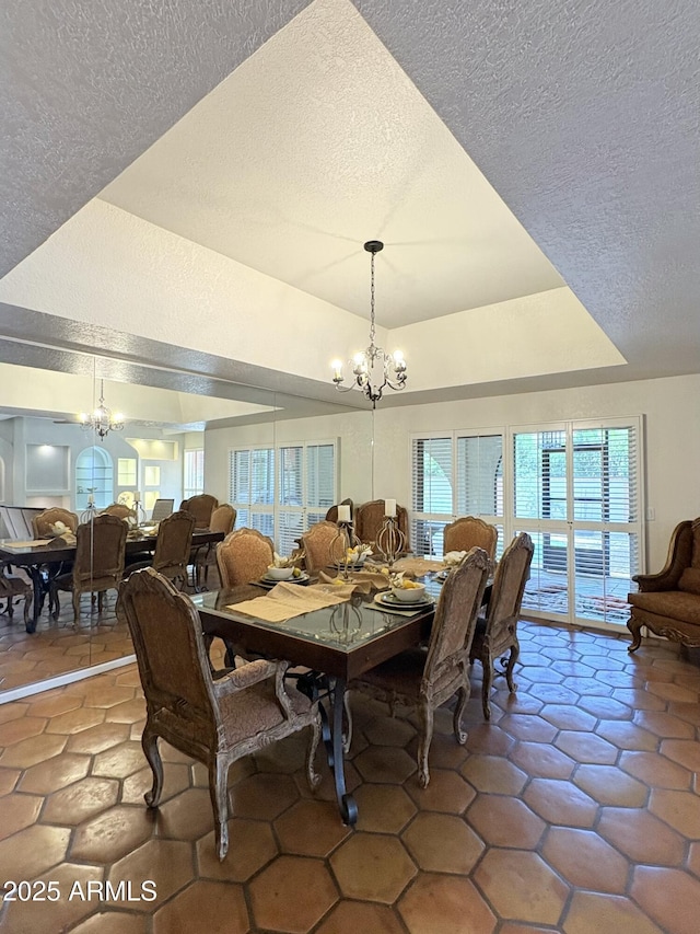8426 N 15th Dr, Phoenix, AZ 85021 - dining room with vaulted ceiling, an inviting chandelier, a textured ceiling, and a wealth of natural light