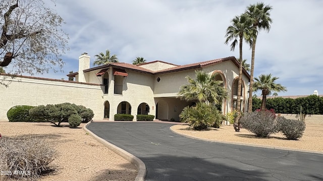 8426 N 15th Dr, Phoenix, AZ 85021 - mediterranean / spanish house featuring stucco siding and a chimney