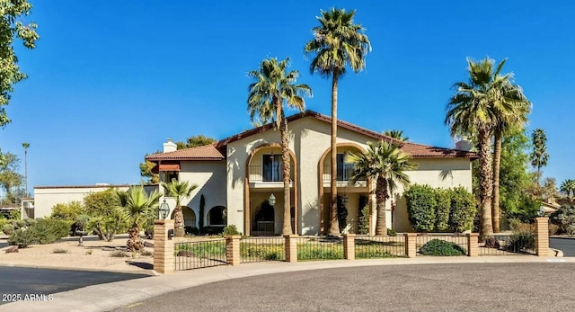 8426 N 15th Dr, Phoenix, AZ 85021 - mediterranean / spanish-style house with a fenced front yard, a chimney, and stucco siding