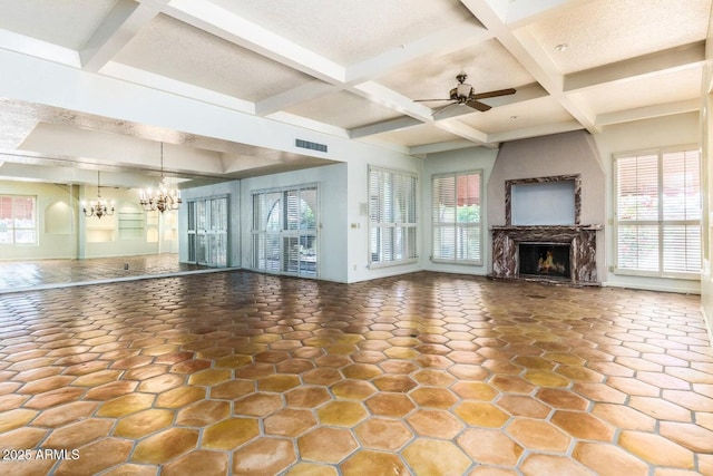 8426 N 15th Dr, Phoenix, AZ 85021 - unfurnished living room with coffered ceiling, a warm lit fireplace, visible vents, beam ceiling, and ceiling fan with notable chandelier
