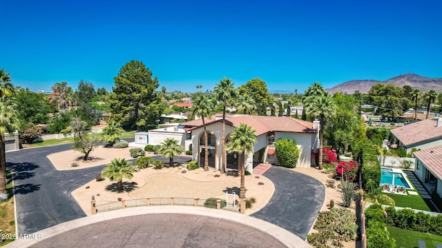 8426 N 15th Dr, Phoenix, AZ 85021 - mediterranean / spanish-style home with stucco siding, a mountain view, and fence