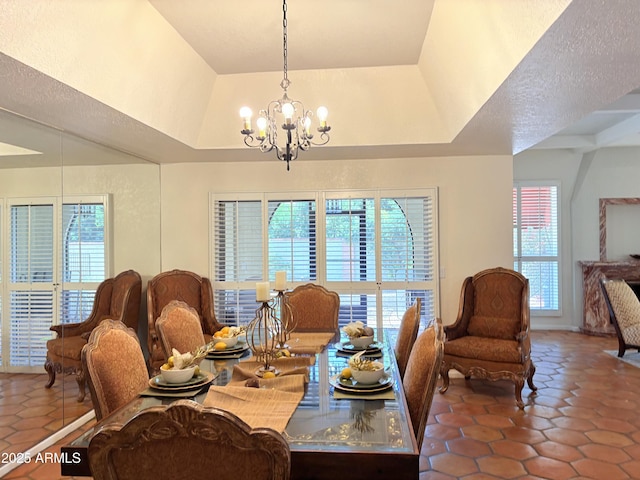 8426 N 15th Dr, Phoenix, AZ 85021 - tiled dining room with plenty of natural light and a notable chandelier
