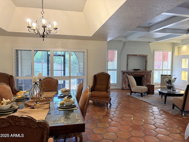 8426 N 15th Dr, Phoenix, AZ 85021 - dining area with tile patterned flooring, coffered ceiling, beamed ceiling, a fireplace, and a notable chandelier