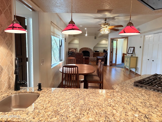 8426 N 15th Dr, Phoenix, AZ 85021 - dining space with wood finished floors, a textured ceiling, and a ceiling fan