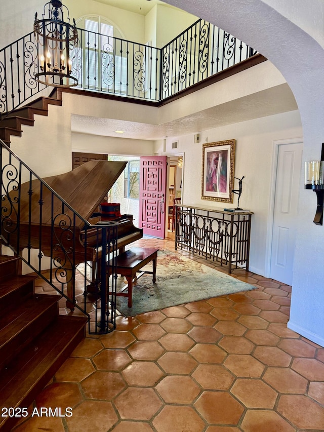 8426 N 15th Dr, Phoenix, AZ 85021 - interior space with arched walkways, tile patterned floors, a high ceiling, and baseboards