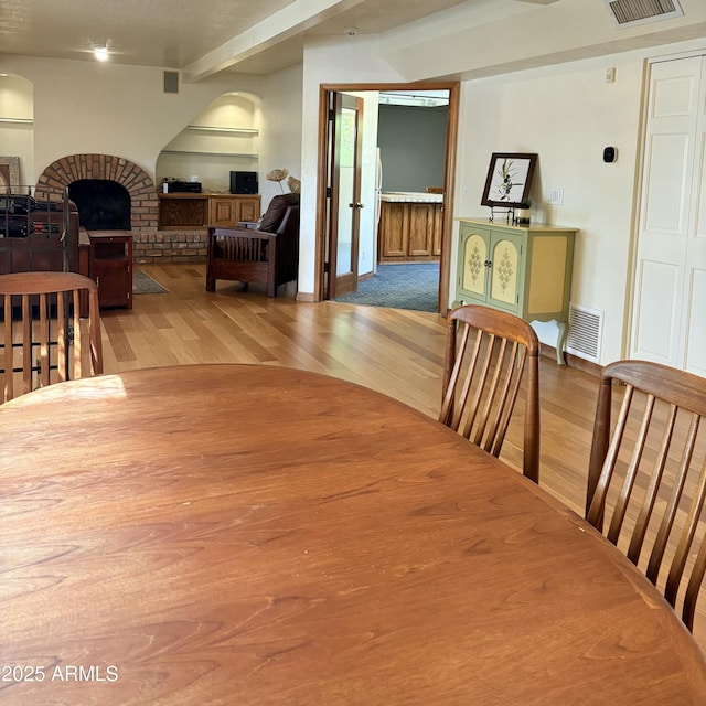 8426 N 15th Dr, Phoenix, AZ 85021 - dining room with beamed ceiling, wood finished floors, and visible vents