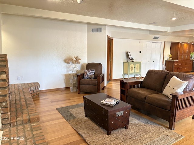 8426 N 15th Dr, Phoenix, AZ 85021 - living area with baseboards, visible vents, and light wood-style floors