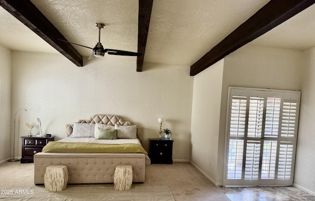 8426 N 15th Dr, Phoenix, AZ 85021 - carpeted bedroom featuring beamed ceiling, baseboards, and a textured ceiling