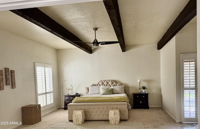 8426 N 15th Dr, Phoenix, AZ 85021 - bedroom with baseboards, a textured ceiling, beam ceiling, and light carpet