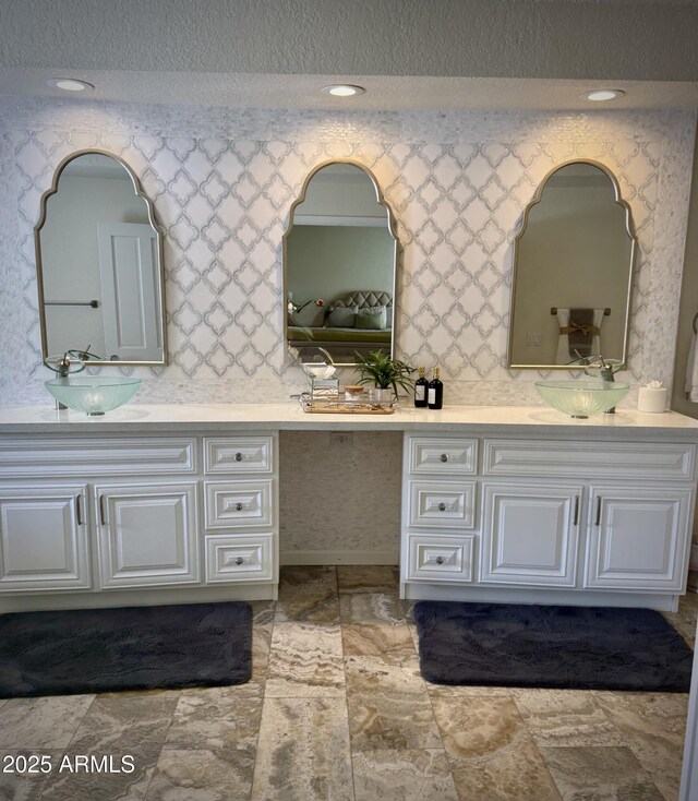 8426 N 15th Dr, Phoenix, AZ 85021 - full bath featuring recessed lighting, a sink, double vanity, and a textured ceiling