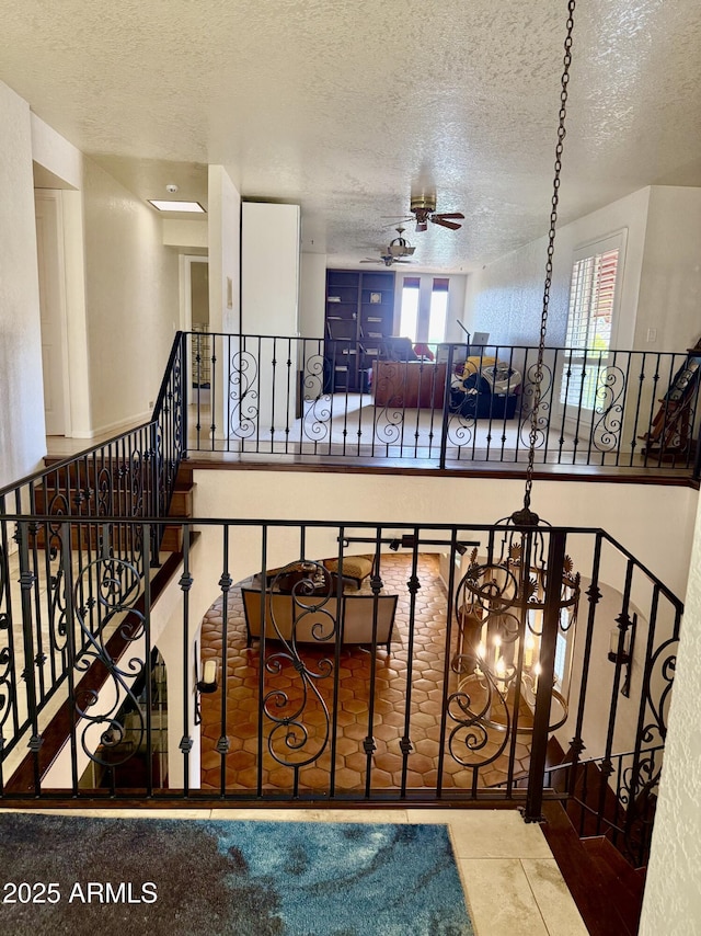 8426 N 15th Dr, Phoenix, AZ 85021 - staircase featuring a textured ceiling and ceiling fan