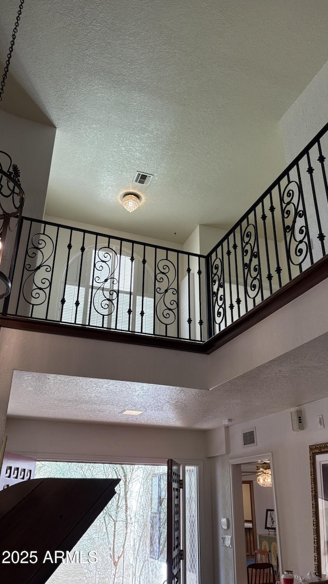 8426 N 15th Dr, Phoenix, AZ 85021 - staircase featuring a towering ceiling, a textured ceiling, and visible vents