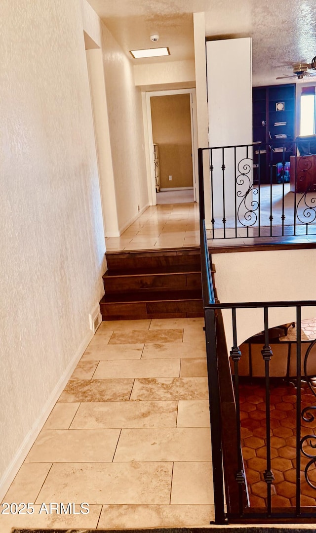 8426 N 15th Dr, Phoenix, AZ 85021 - stairway featuring a textured wall and baseboards