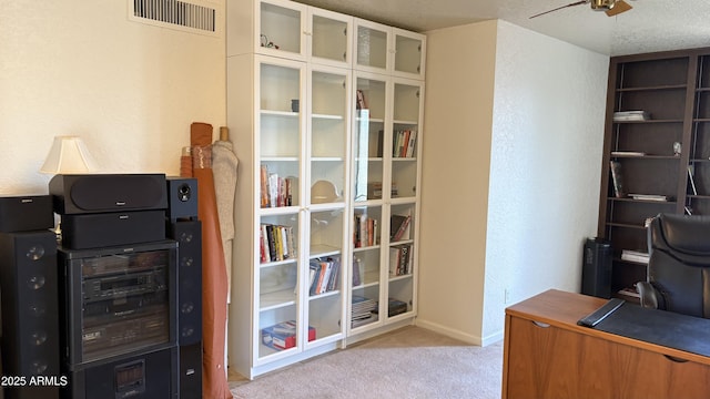 8426 N 15th Dr, Phoenix, AZ 85021 - office area with carpet flooring, baseboards, visible vents, ceiling fan, and a textured wall