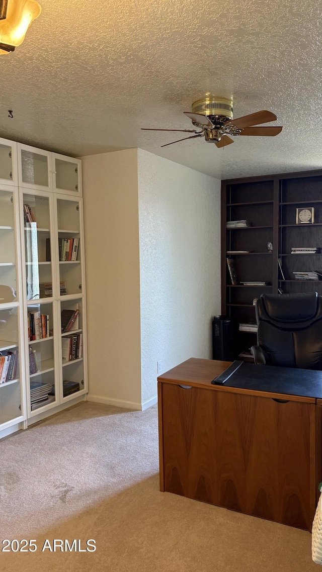 8426 N 15th Dr, Phoenix, AZ 85021 - carpeted home office with baseboards, a textured ceiling, and ceiling fan