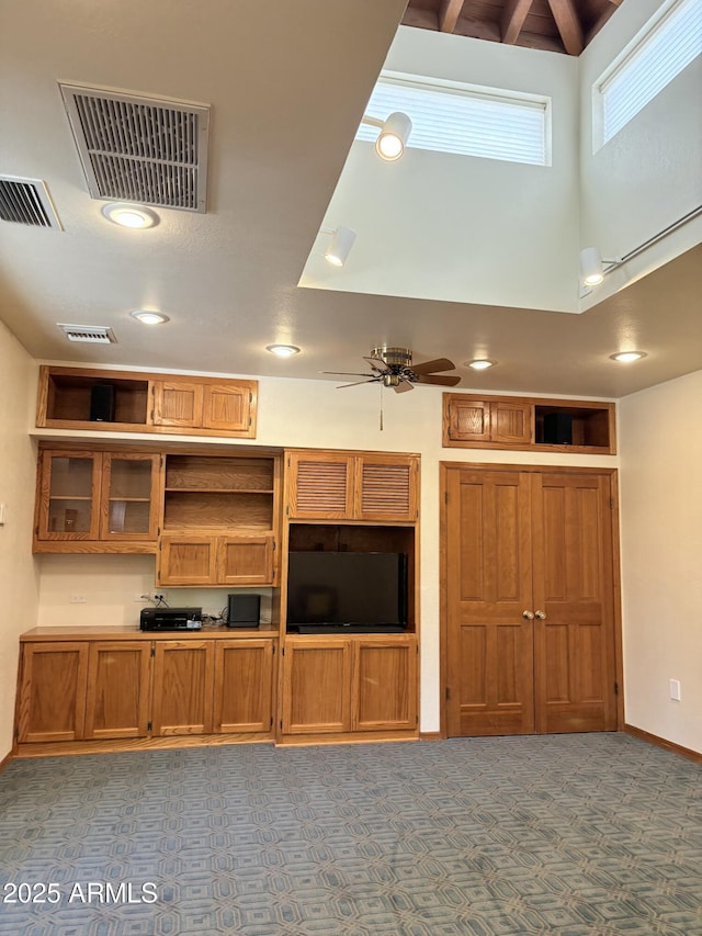 8426 N 15th Dr, Phoenix, AZ 85021 - unfurnished living room with a ceiling fan, a towering ceiling, and visible vents