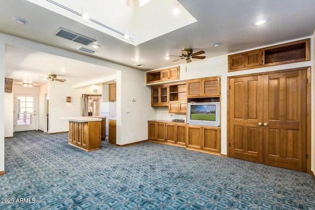 8426 N 15th Dr, Phoenix, AZ 85021 - kitchen featuring ceiling fan, visible vents, open shelves, and dark colored carpet