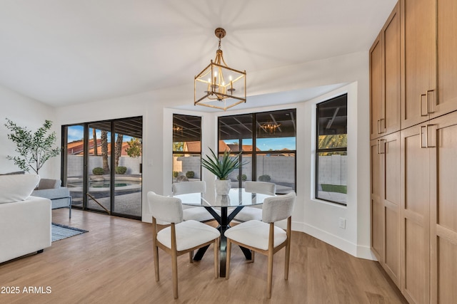 1001 N Nielson St, Gilbert, AZ 85234 - dining room with a chandelier, light wood-style flooring, and baseboards