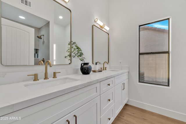 1001 N Nielson St, Gilbert, AZ 85234 - full bathroom with double vanity, baseboards, wood finished floors, and recessed lighting