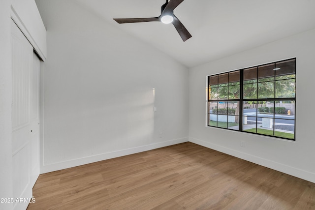 1001 N Nielson St, Gilbert, AZ 85234 - unfurnished bedroom with a closet, lofted ceiling, light wood-style floors, baseboards, and ceiling fan