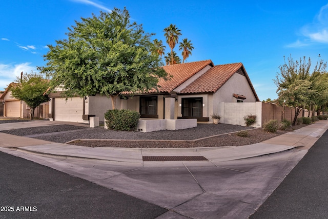 1001 N Nielson St, Gilbert, AZ 85234 - view of front facade with an attached garage, stucco siding, a tiled roof, and driveway
