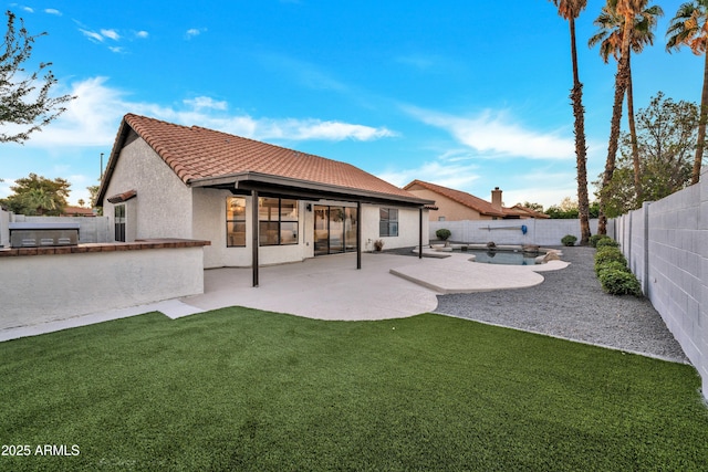 1001 N Nielson St, Gilbert, AZ 85234 - back of house featuring a tile roof, a patio, and stucco siding